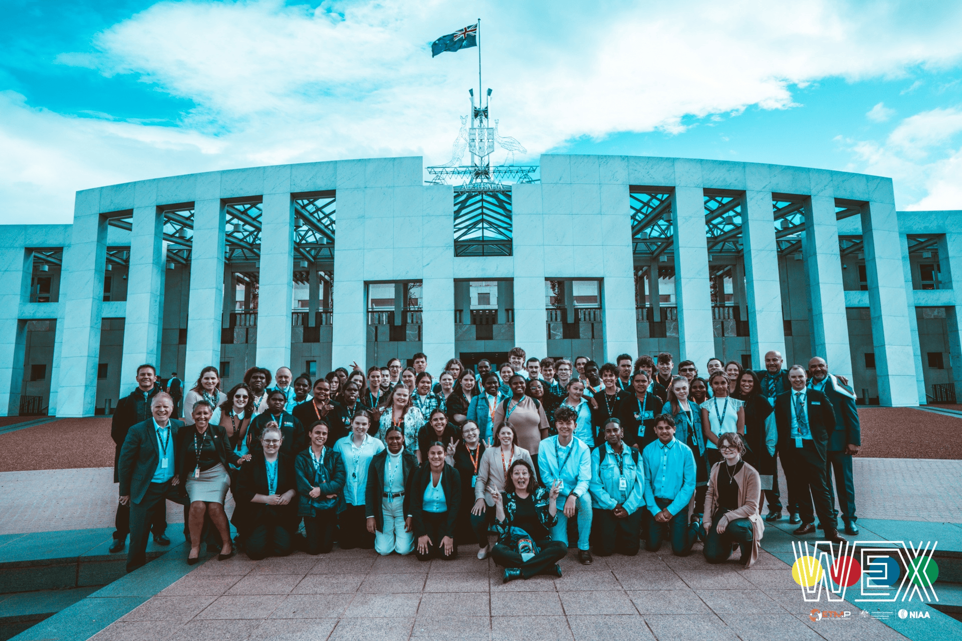 The WEX Canberra 2022 group photographed on the steps of Parliament House