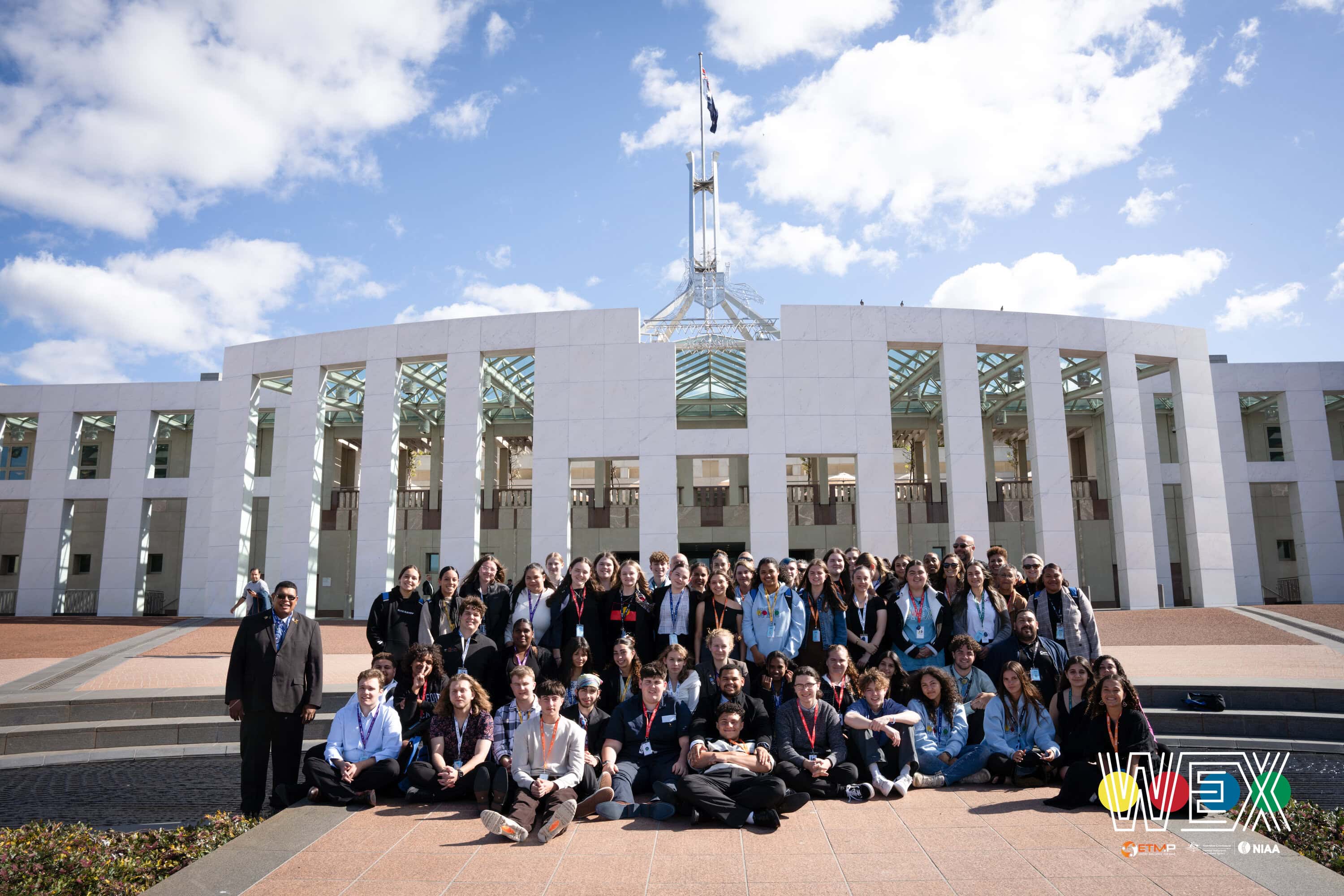 The WEX Canberra 2024 group photographed in front of Parliament House